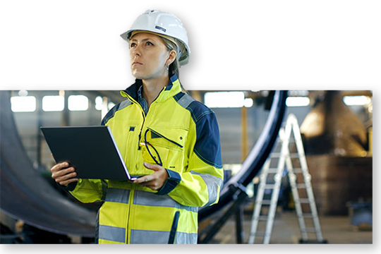 Worker with laptop inspecting 