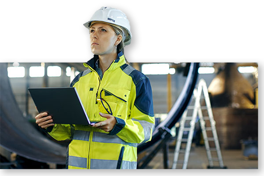 Worker with laptop inspecting